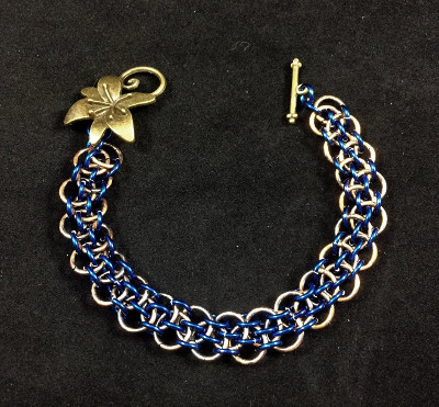 Copper bracelet with deep blue accents